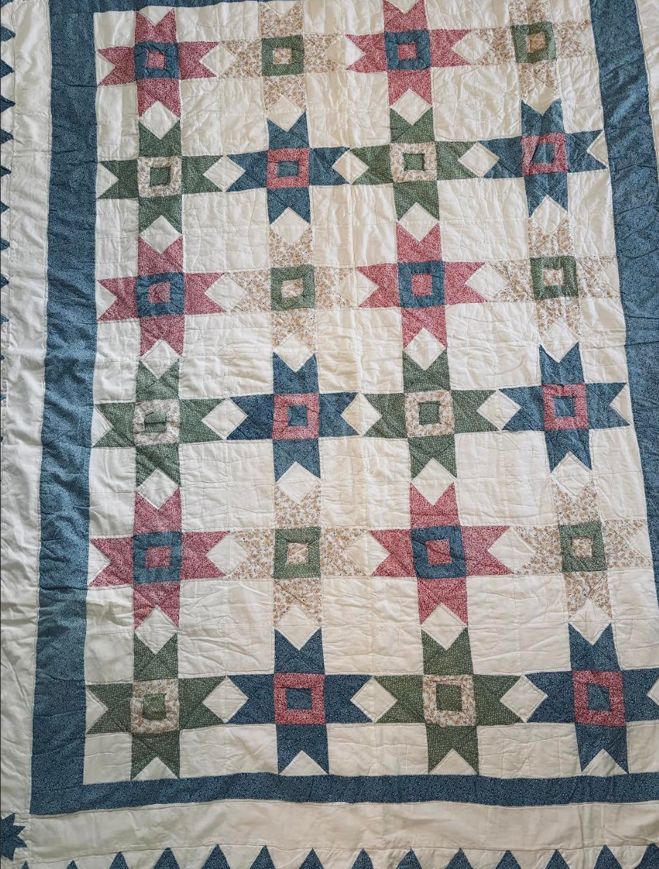 multi color handmade star quilt in green blue cream and red antique vintage